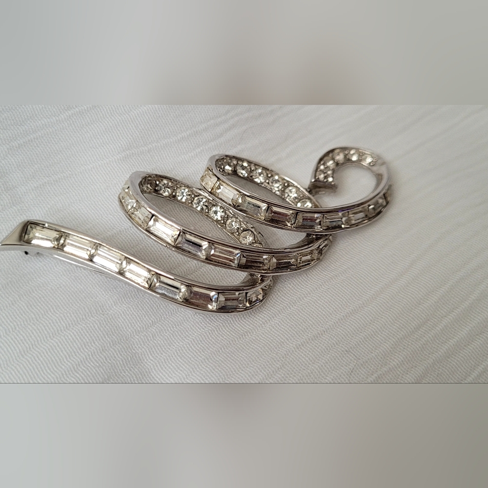 Elegant Silver Toned Marcel Boucher Clear Crystal Stylized Ribbon Brooch 1960s
